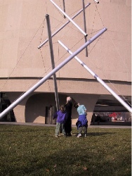 snapshot of family members under Tensegrity Tower at the Hirshhorn