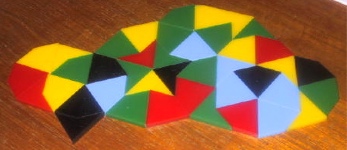 a photo of an arrangement of kites and darts